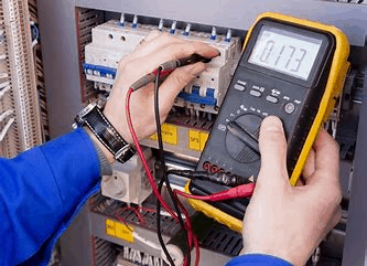 electrician undertaking electrical safety checks