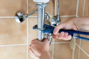 local plumber repairing a bathroom plumbing in chicagoland home